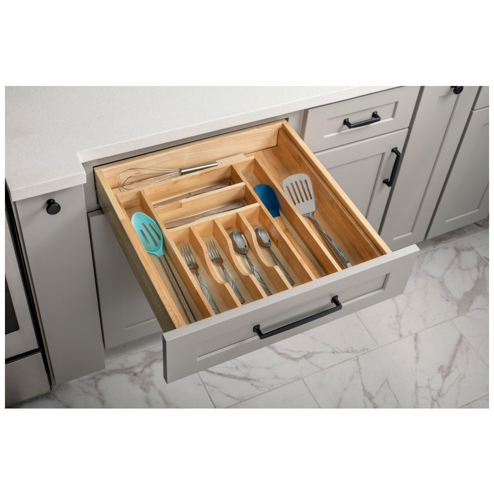 Wide cutlery drawer organizer with cooking tools in a gray cabinet drawer