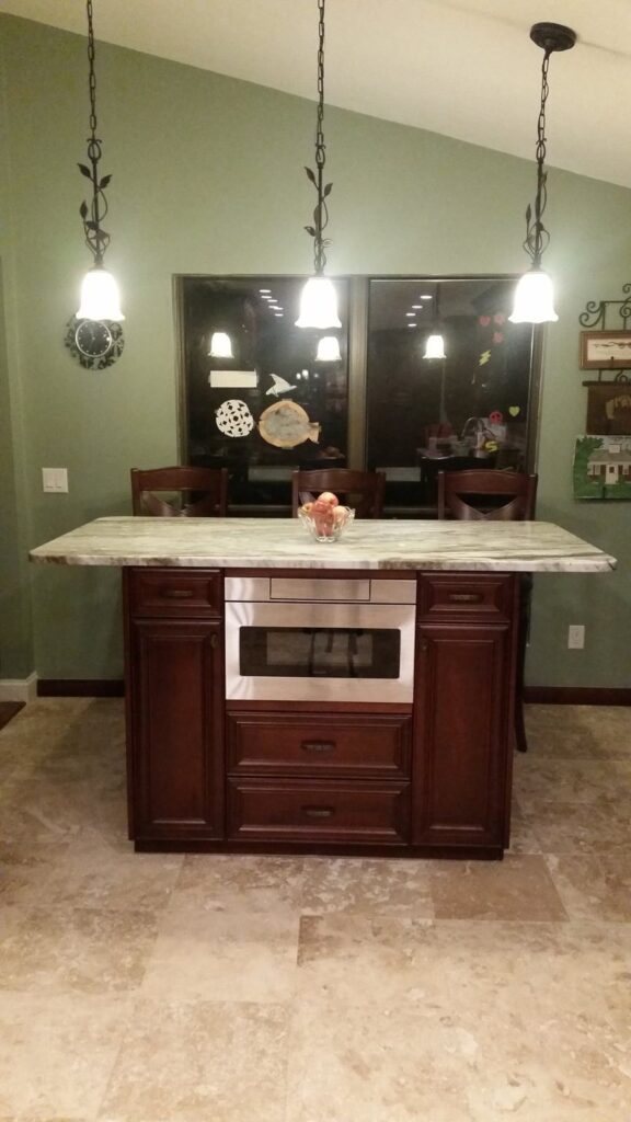 Kitchen island with built-in microwave drawer