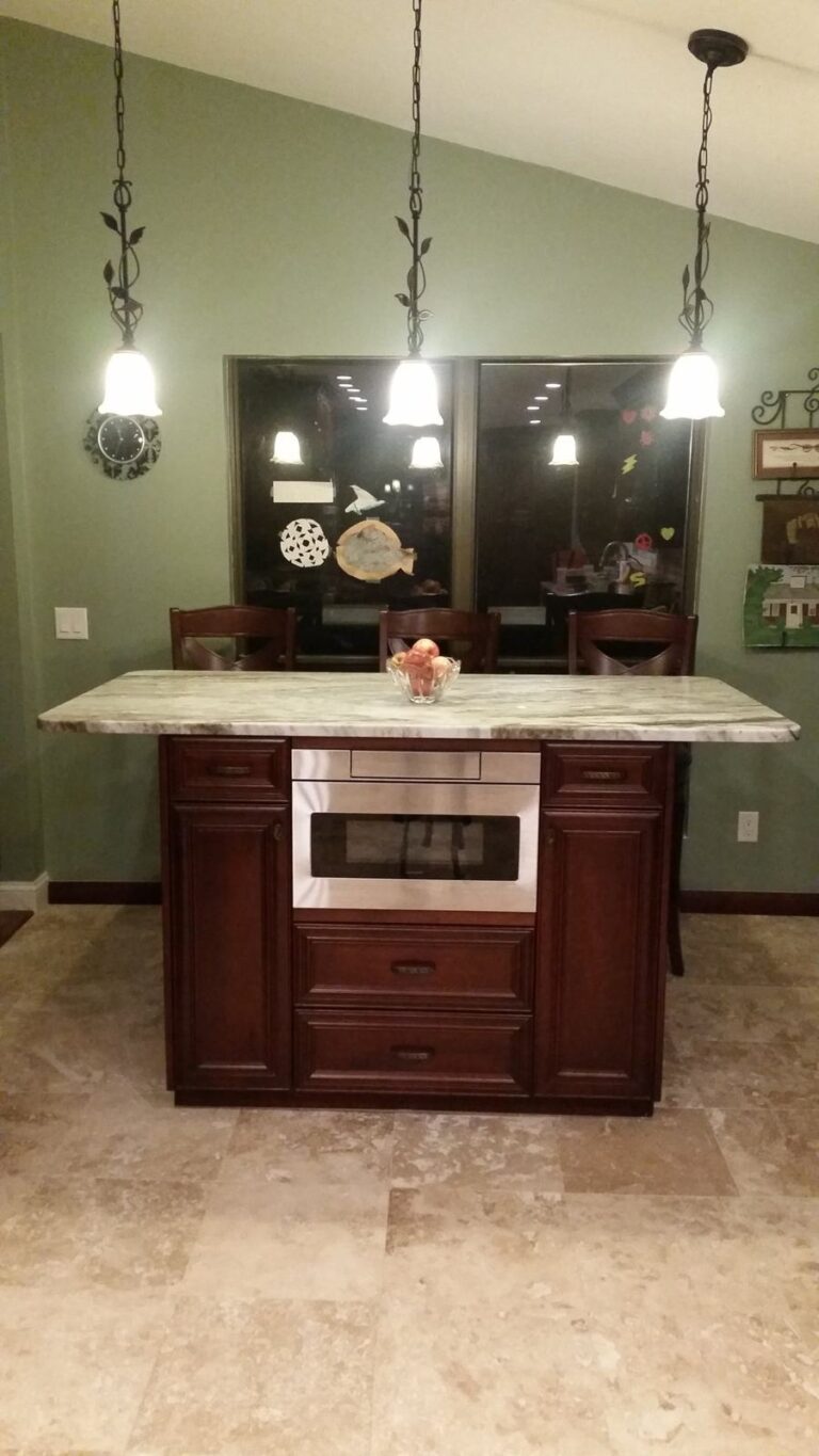 Kitchen island with built-in microwave drawer