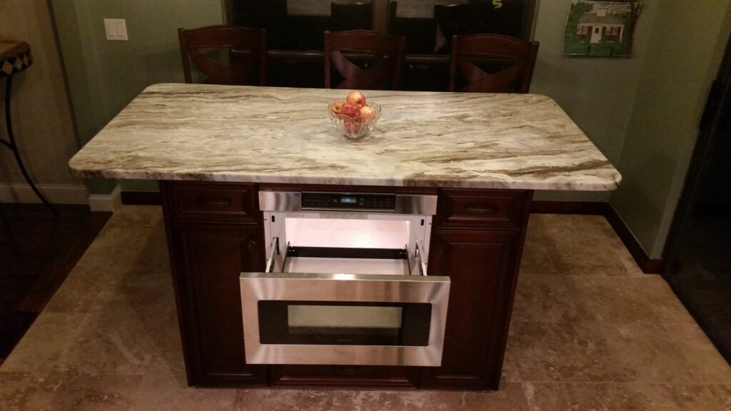 Microwave drawer open in a kitchen island