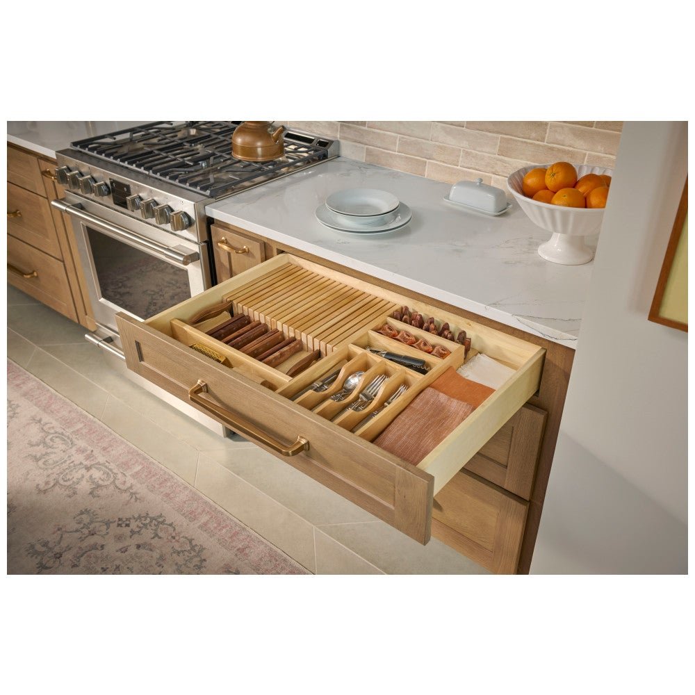 Knife block drawer insert in a drawer beside the range