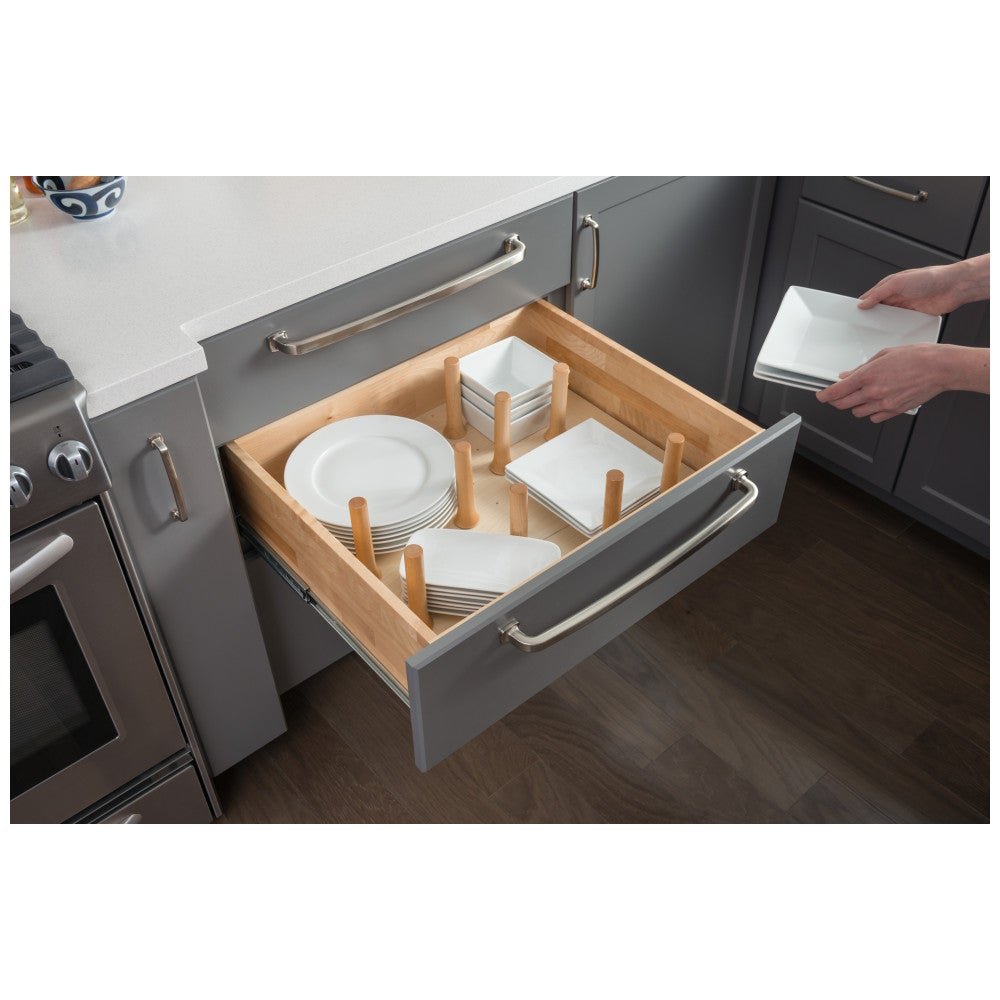 Peg board drawer organizer holding plates and bowls in a deep drawer