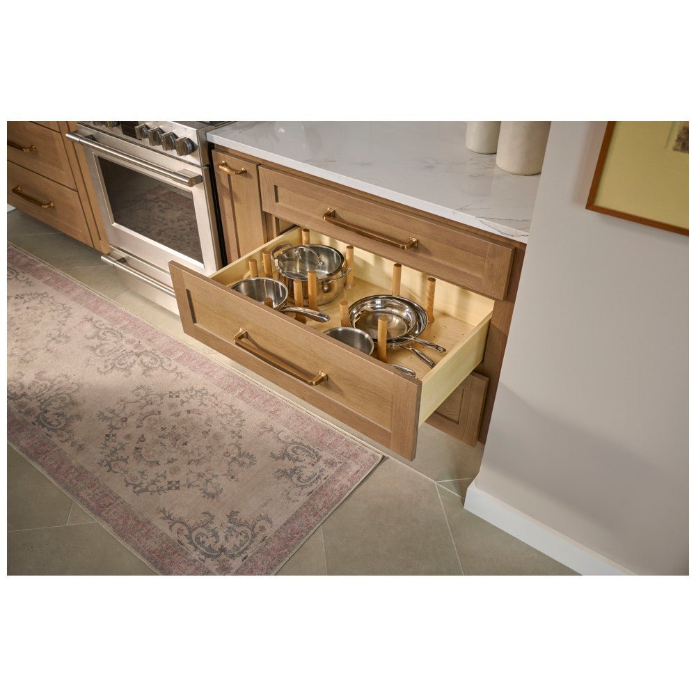 Peg board drawer insert holding pots and pans in a deep drawer