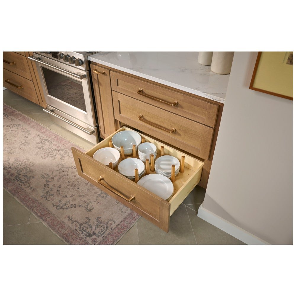 Peg board drawer insert holding stacked bowls in a deep drawer