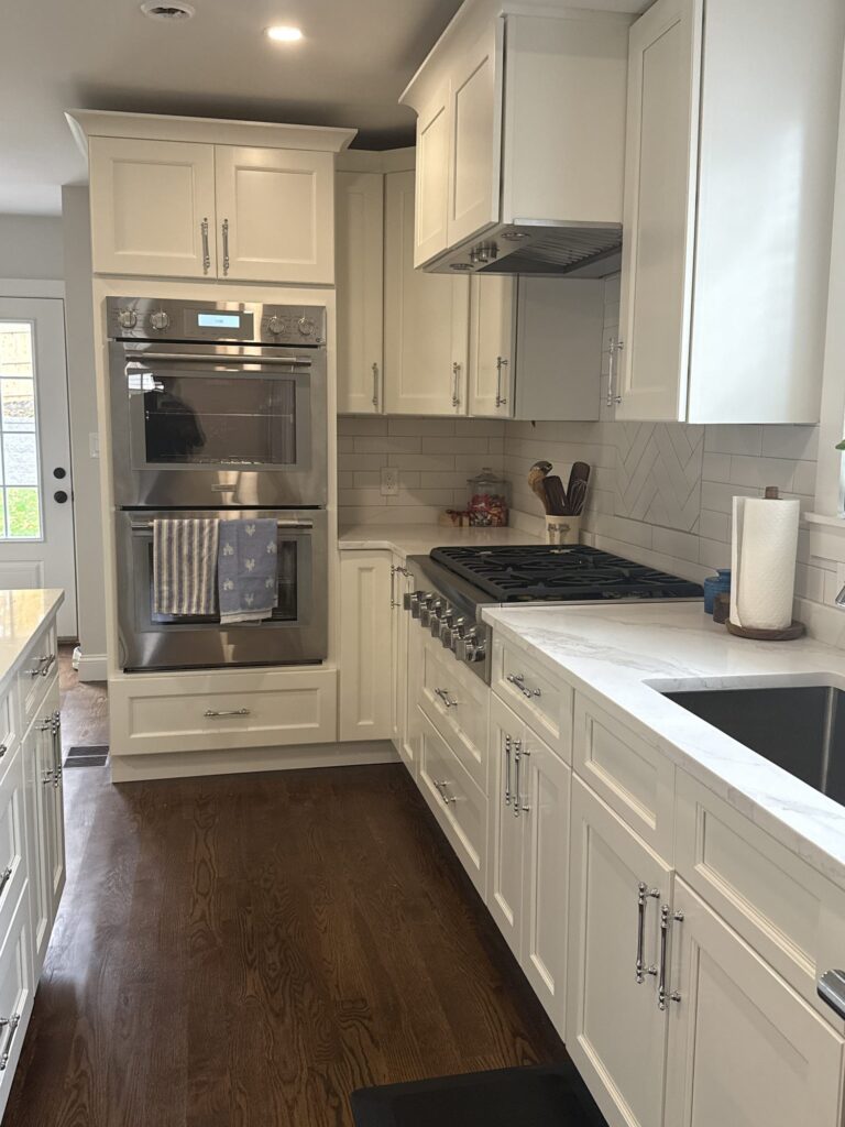 Beverage station with glass-door cabinets, wine storage and under-counter wine fridge – West Roxbury