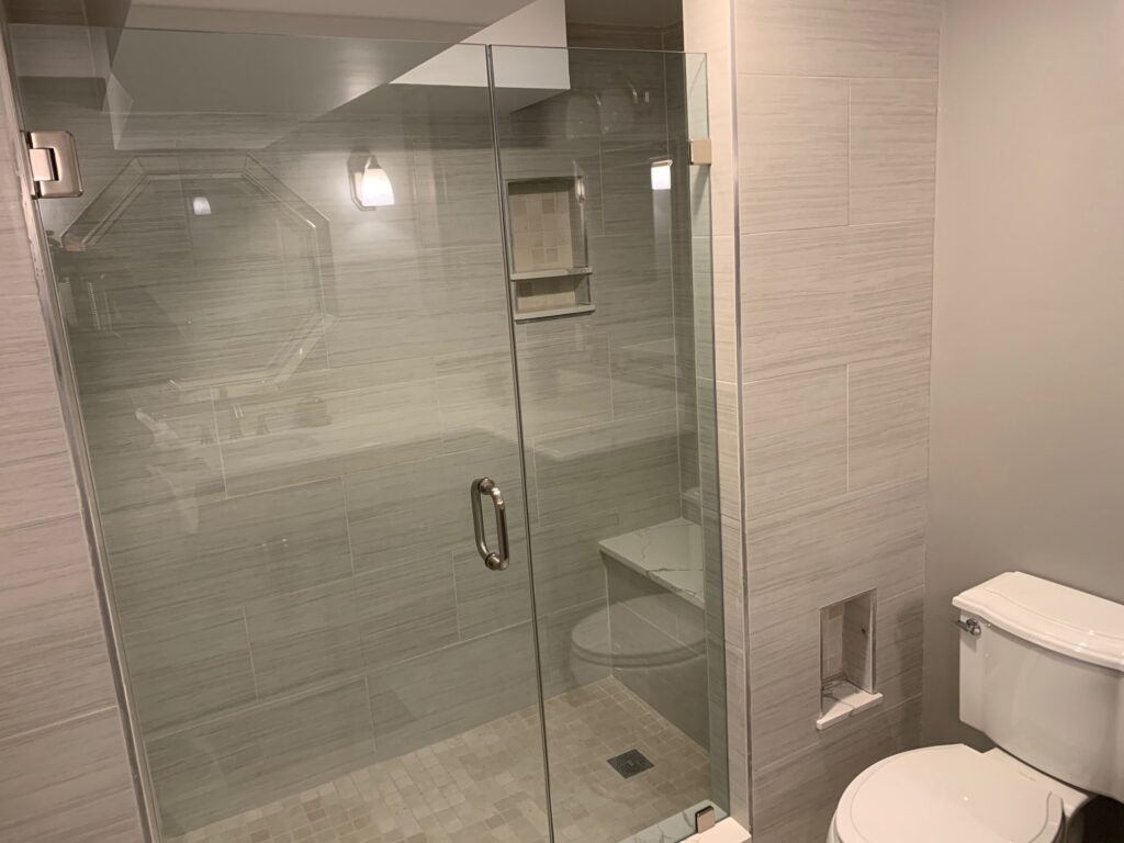 Frameless glass shower in a finished basement bathroom – Randolph
