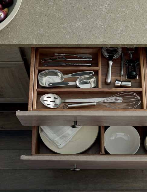 A cabinet with every drawer customized through Omega Blueprint, from utensils to dinnerware
